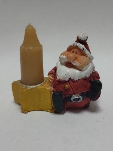 Свеча новогодняя в подсвечнике с изображением Санта Клауса